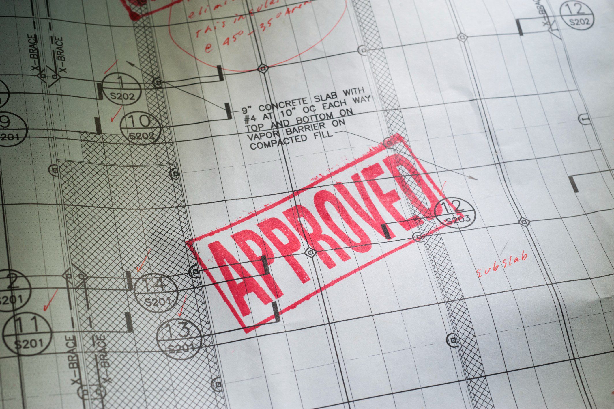 Blueprint with red "Approved" stamp.