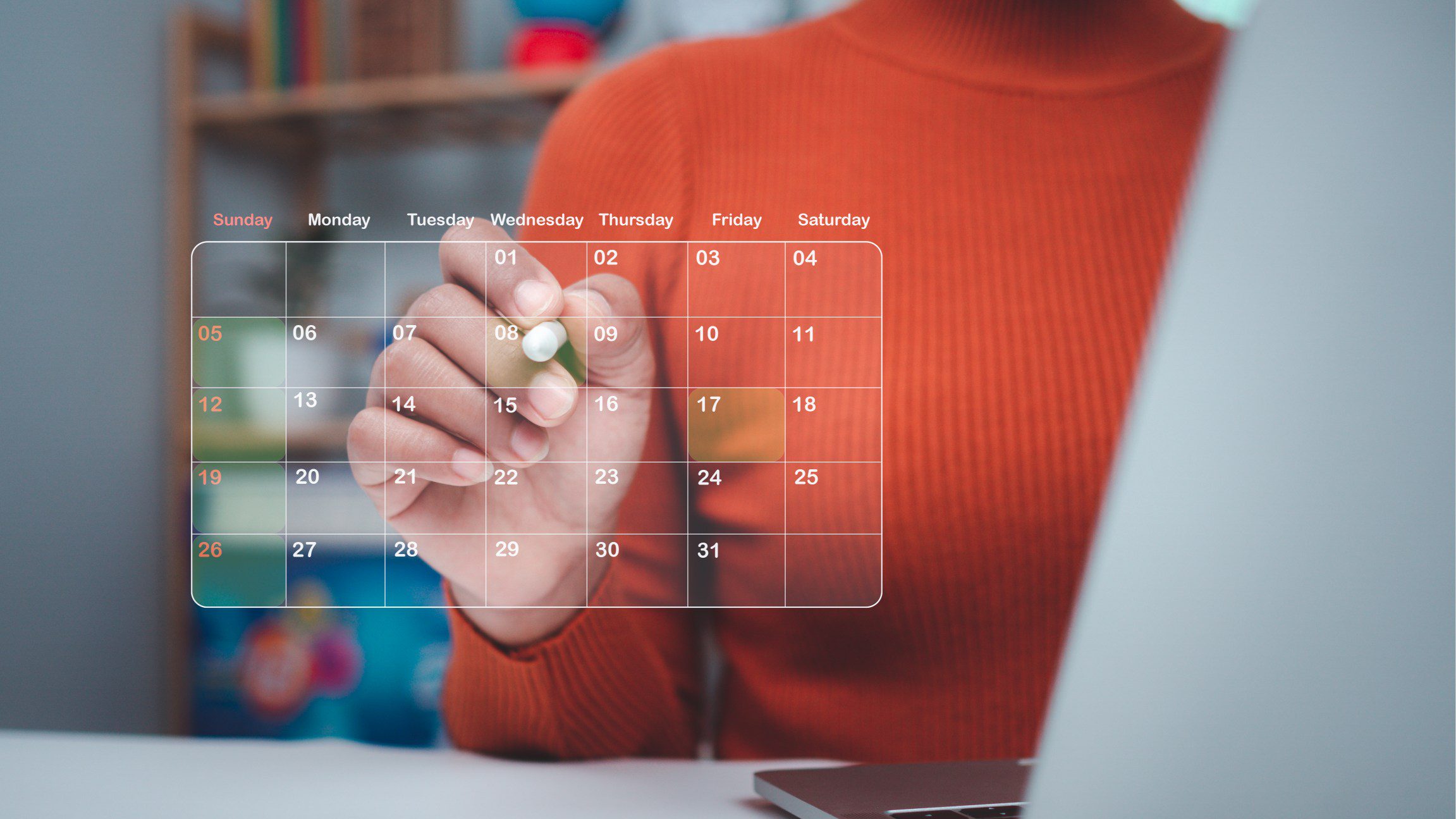 Person interacting with digital calendar interface.