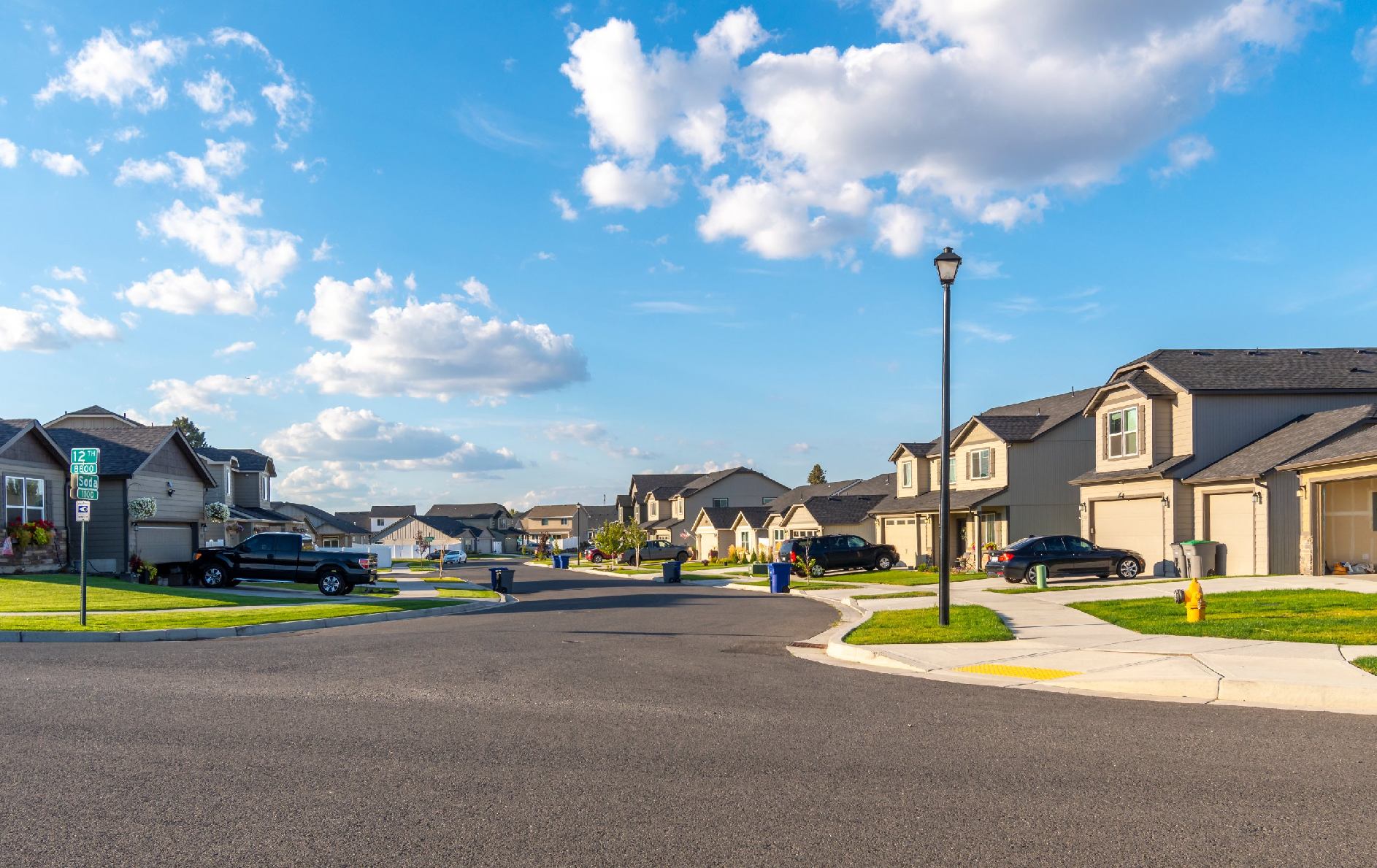 Suburban neighborhood street with modern houses.