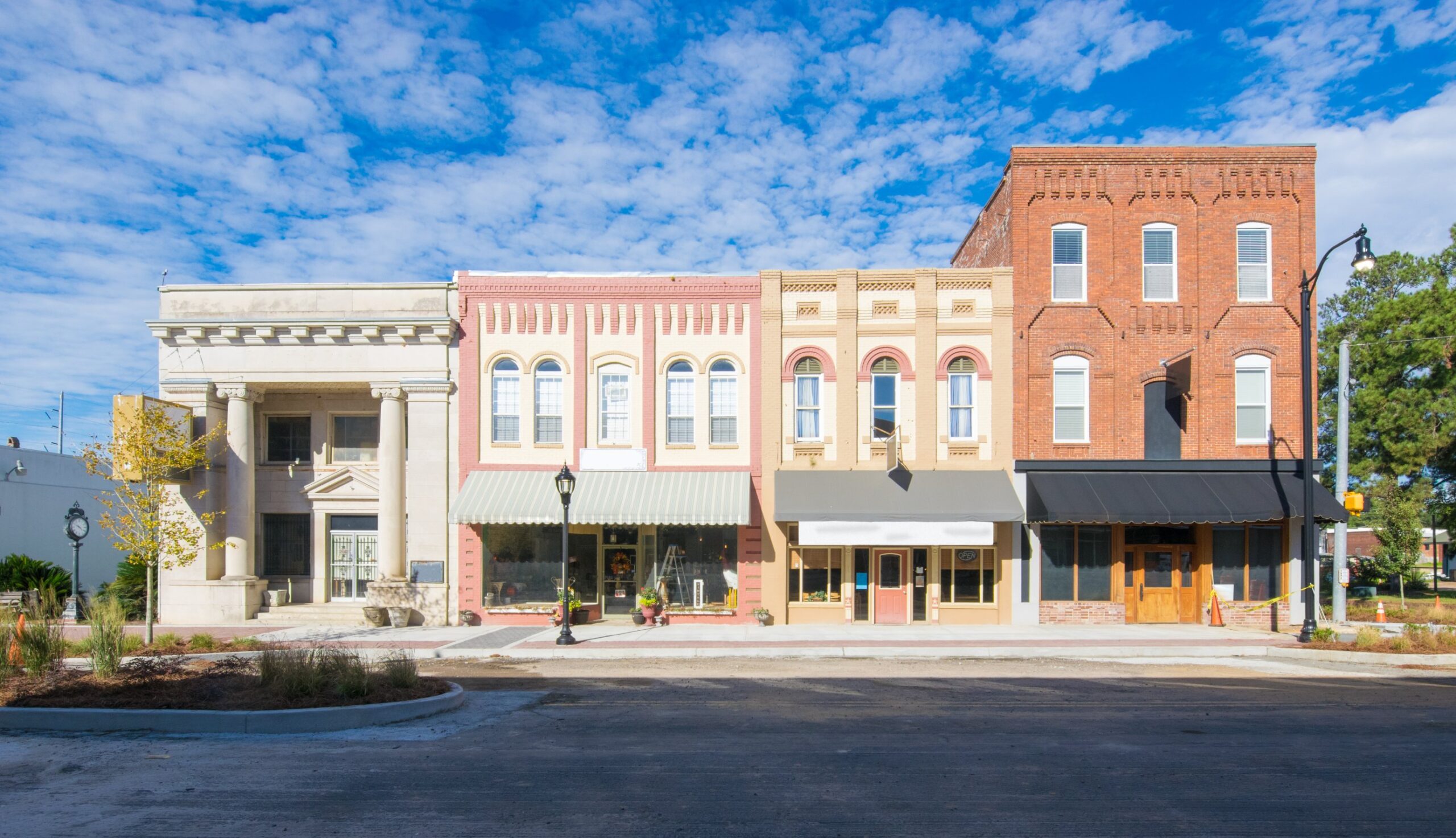 Historic downtown buildings under blue sky.
